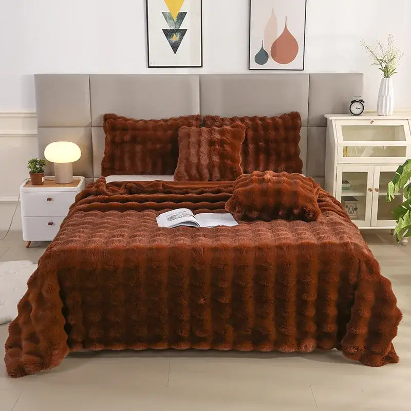 Warm rust-colored faux fur bed set with plush quilt and pillows featuring decorbites bubble rabbit velvet texture