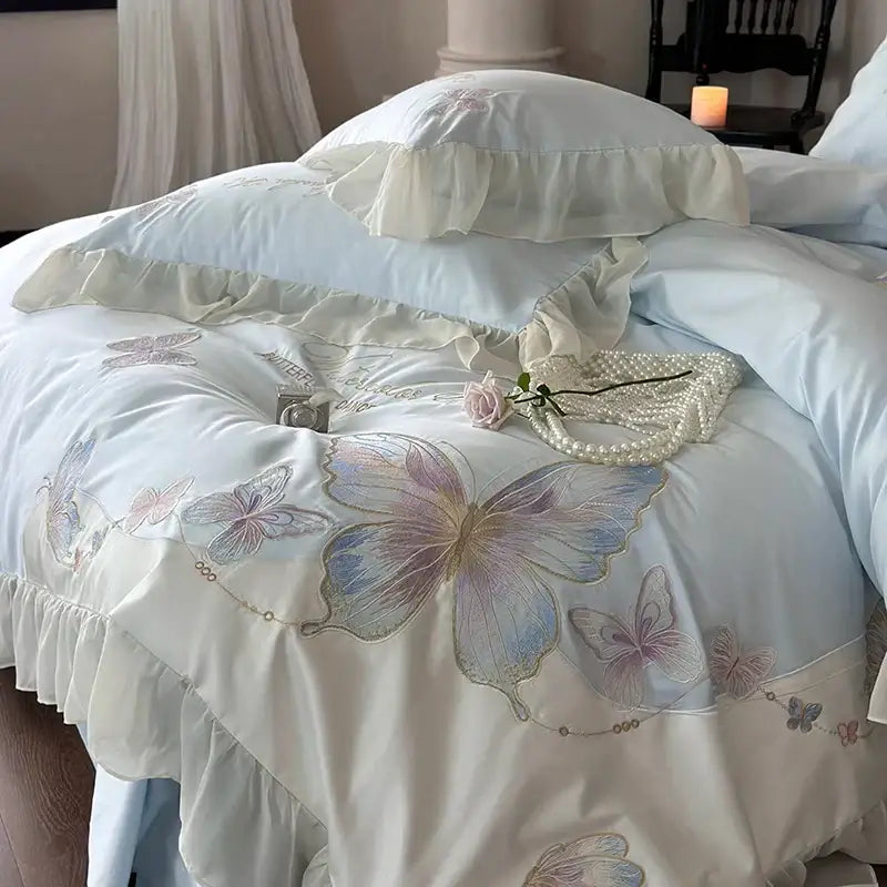 Light blue satin duvet cover bedding set with butterfly embroidery and decorbites french lace ruffled edge detail