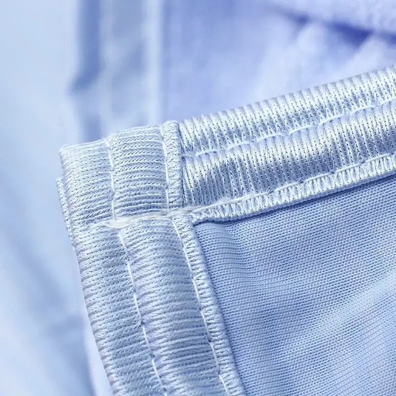 Light blue denim decorbites cool feel summer blanket with subtle texture and reinforced hem stitching for bedroom use