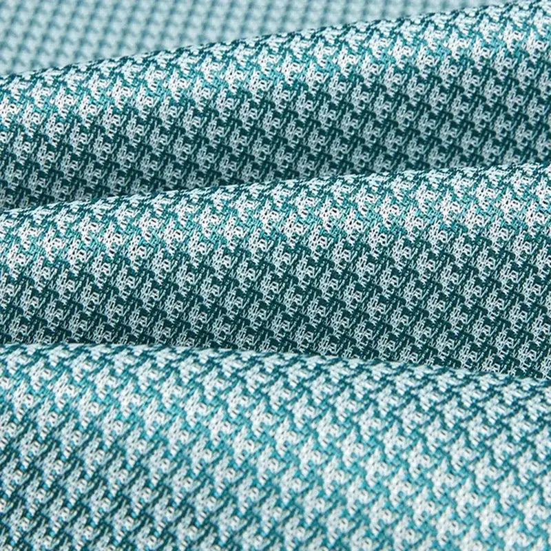 Teal and white herringbone woven light blue cooling jacquard fitted sheet with textured interlaced pattern by decorbites