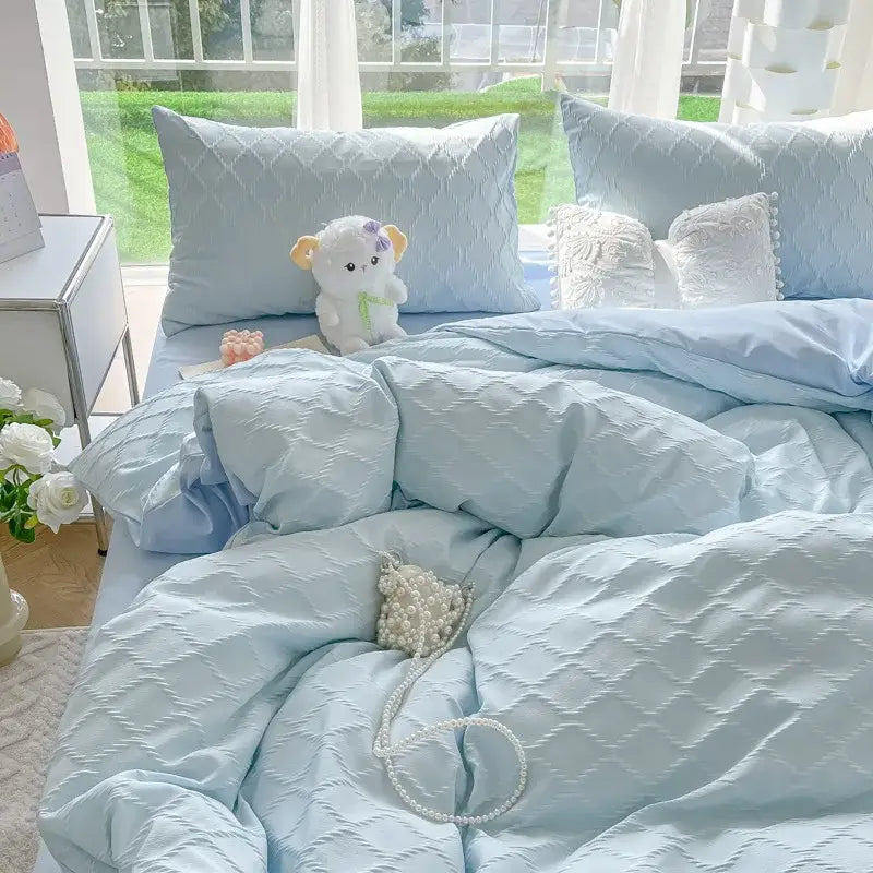 Light blue quilted duvet set with subtle diamond grid jacquard pattern in grid jacquard bedding sets for bedroom comfort