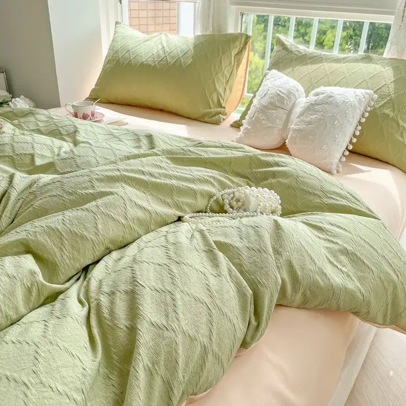 Soft sage green textured duvet cover with subtle crinkled fabric finish for light blue diamond grid jacquard bedding sets
