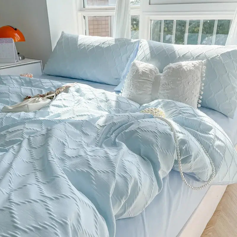 Light blue quilted duvet cover with subtle textured pattern in diamond grid jacquard bedding sets for bedroom comfort