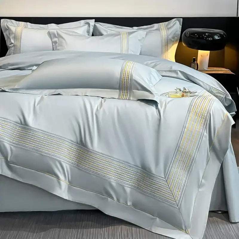 Light blue egyptian cotton embroidery duvet cover bedding set with elegant gold thread detailing along edges