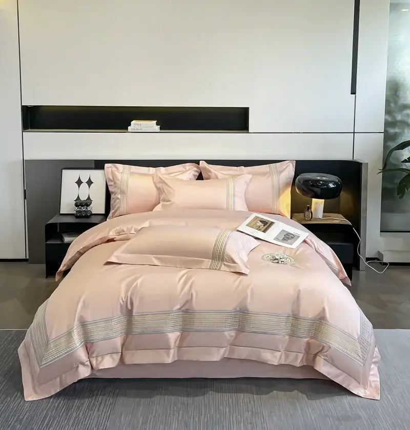Pink satin bedding set with subtle metallic trim paired with light blue egyptian cotton embroidery duvet cover