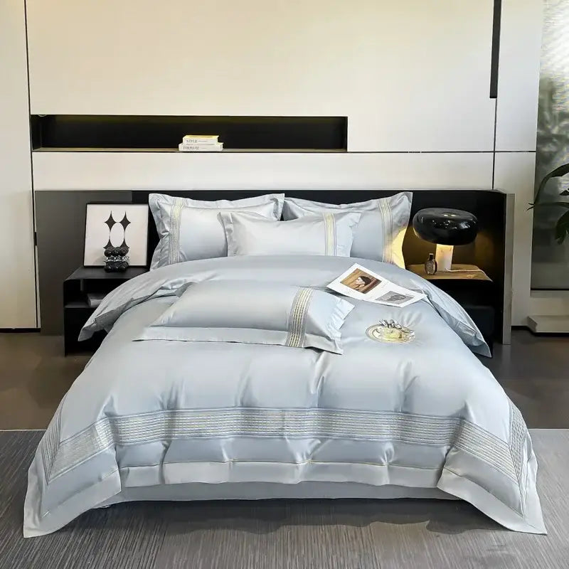 Light blue egyptian cotton embroidery bedding set with satin-like duvet cover featuring gold thread accents and circular motif