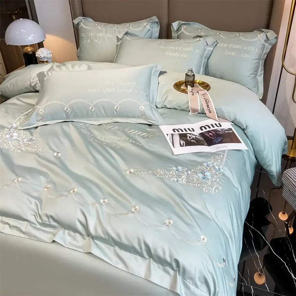 Light blue embroidered egyptian cotton bedding set with delicate white floral embroidery and satin luxe finish