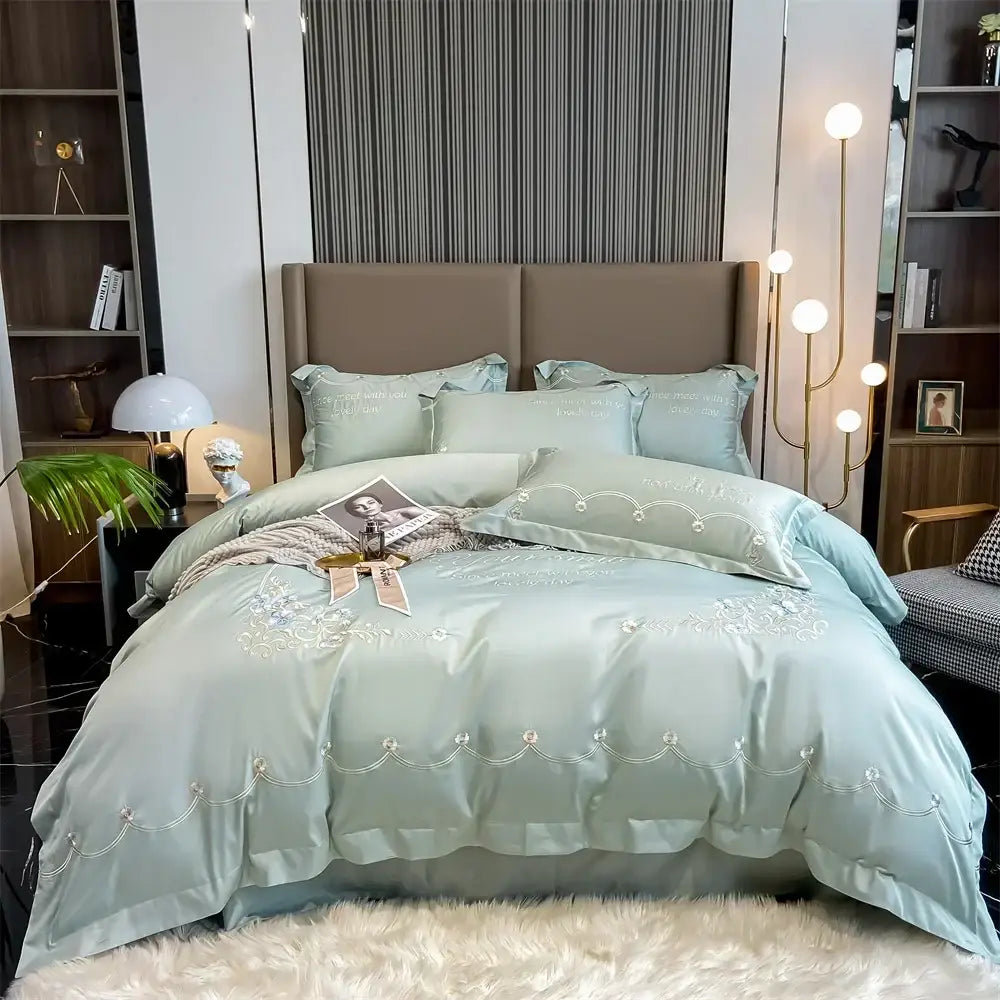 Light blue satin egyptian cotton bedding sets with delicate white embroidery and beaded detailing for bedroom luxe