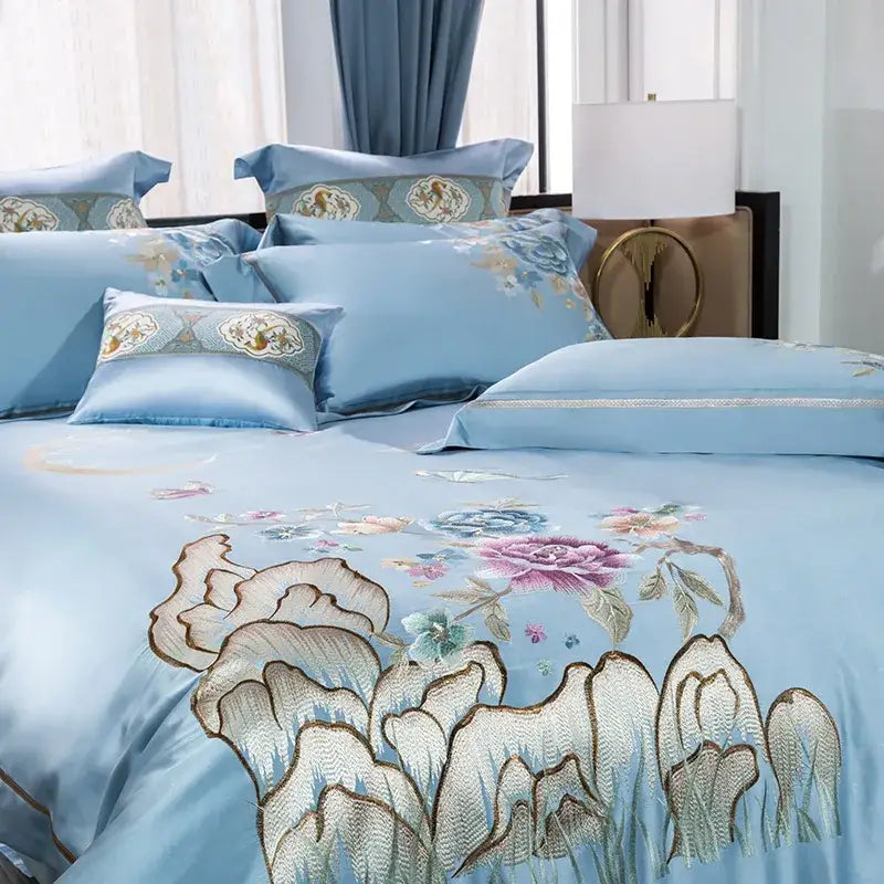 Light blue satin bedding set with intricate pink purple and gold 200s cotton embroidery floral accents