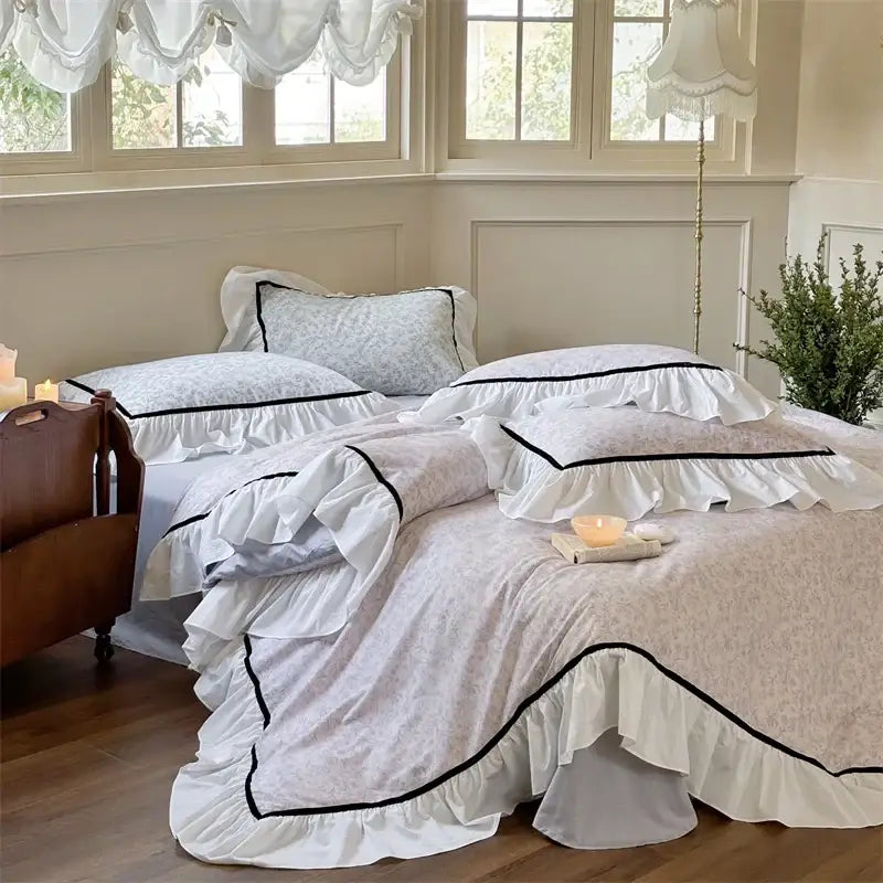 White ruffled cotton bedding sets with delicate floral patterns and black trim from decorbites cotton bedding collection