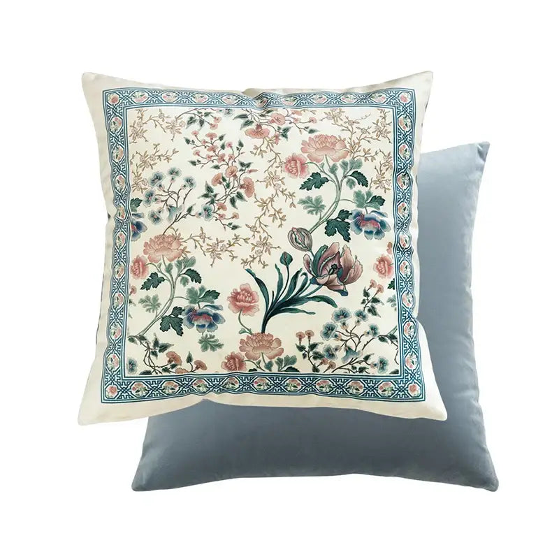 Square pillow cover with intricate floral embroidery in soft pinks blues and greens and ornate teal border ideal for flower fragrance pillow decor