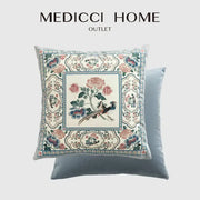 Light blue velvet pillow cover with intricate embroidered pink and teal flowers and a central bird motif for flower fragrance decor
