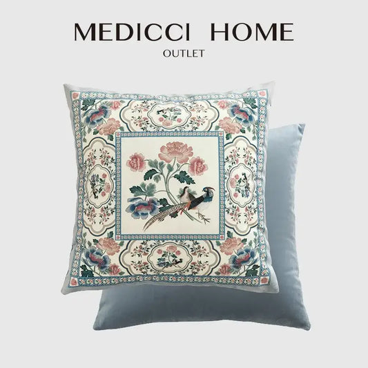 Light blue velvet pillow cover with intricate embroidered pink and teal flowers and a central bird motif for flower fragrance decor