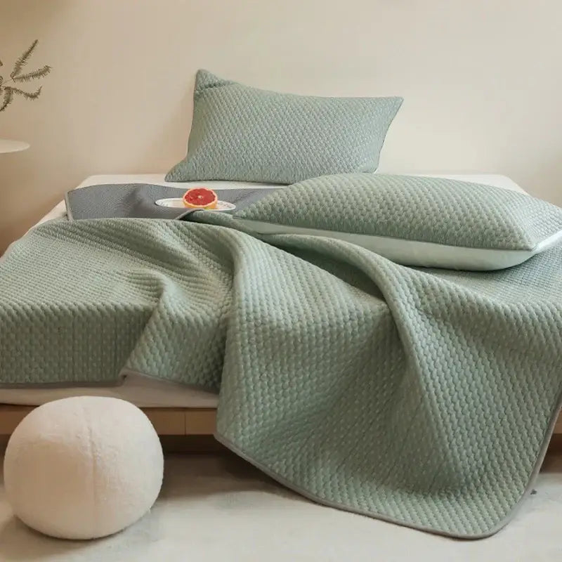 Light green quilted bedspread with textured woven pattern and plush feel in decorbites ice bean bed sheet set bedroom cooling sleep mat