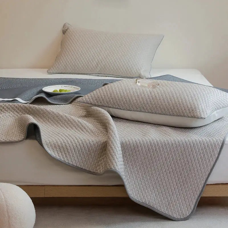 Beige quilted bedspread with gray border and diamond pattern from decorbites ice bean bed sheet set for cooling sleep