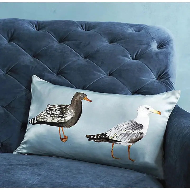 Light blue heron embroidered silk throw pillow cover with detailed seabird illustrations for living room decor