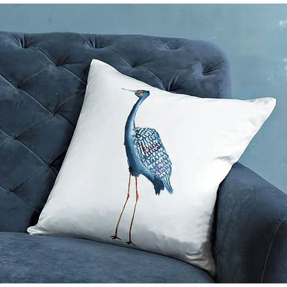 White cushion with blue crane detailed embroidery featuring iridescent feathers and orange legs silk throw pillow cover