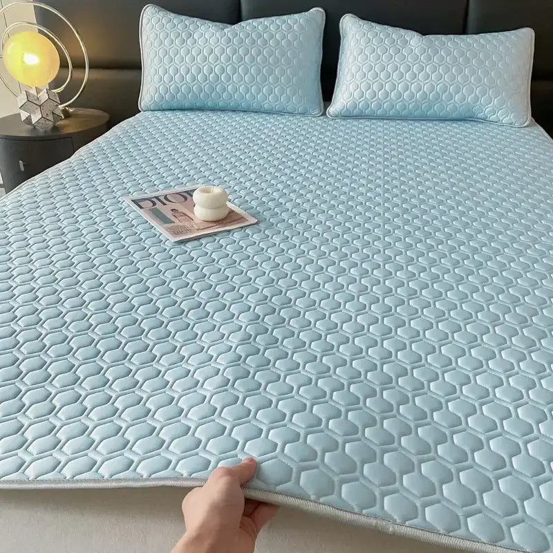 Light blue hexagonal cooling latex filled bed mat with soft quilted texture for bedroom comfort