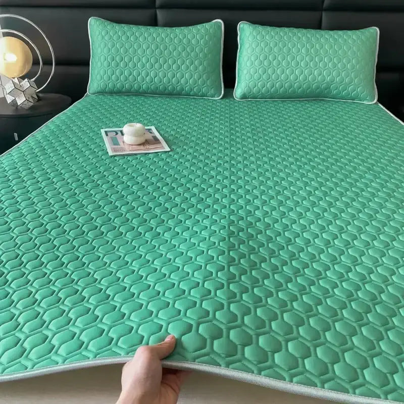 Mint green hexagonal quilted latex filled bed mat set with matching pillowcases for cooling bedroom comfort
