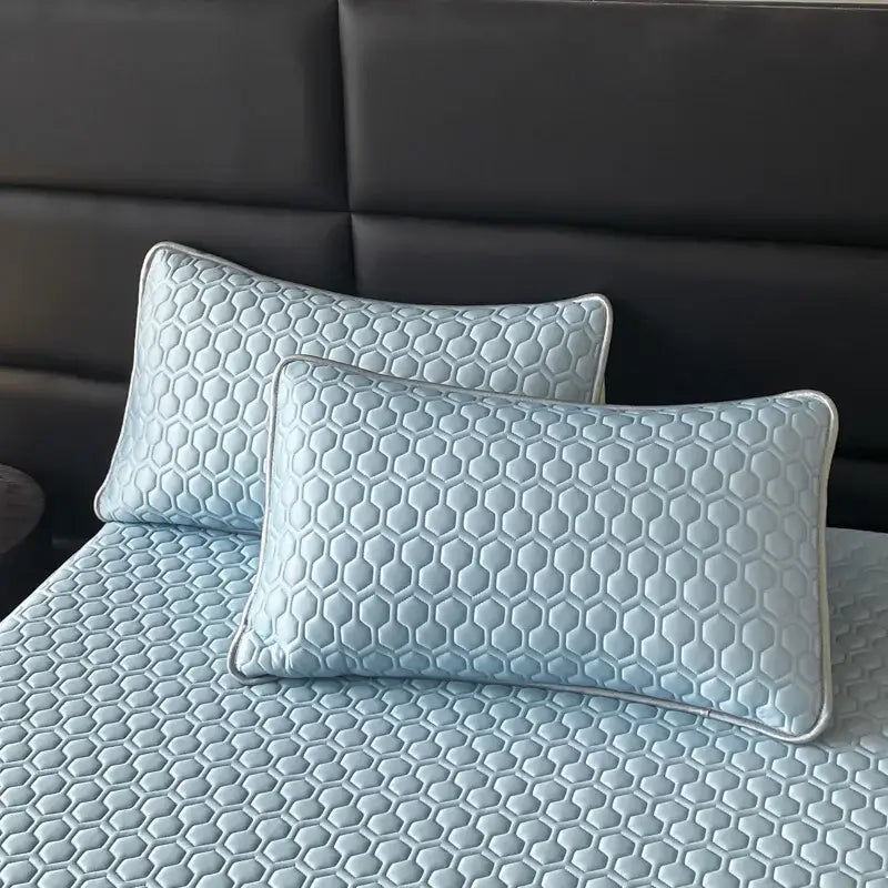 Light blue hexagonal ice silk cooling bed mat set with honeycomb quilted pillowcases and silver piping