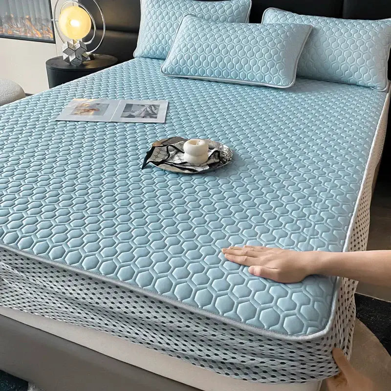 Light blue hexagonal ice silk cooling bed mat set with breathable mesh border for comfortable bedroom use