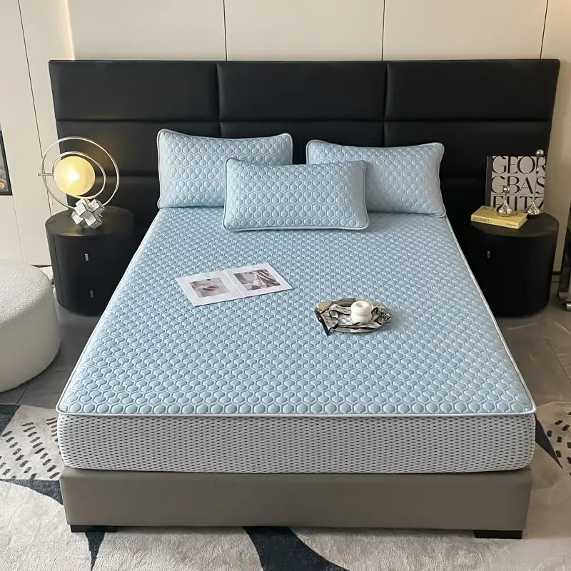 Light blue hexagonal ice silk cooling bed mat set with quilted honeycomb texture and gray perforated side panels