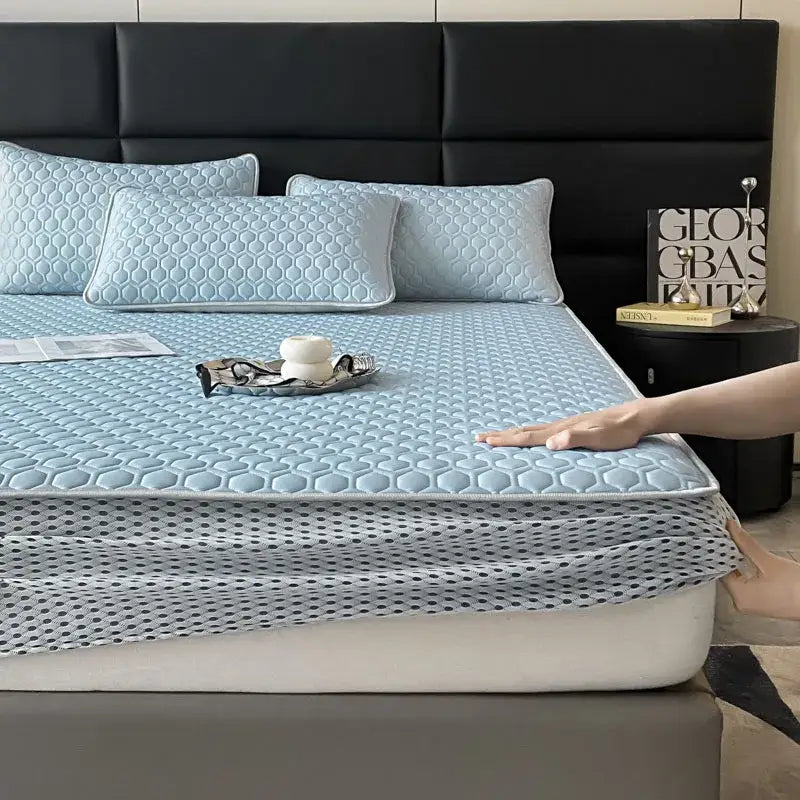 Light blue hexagonal ice silk cooling quilted bed mat set with honeycomb texture and black polka dot edge