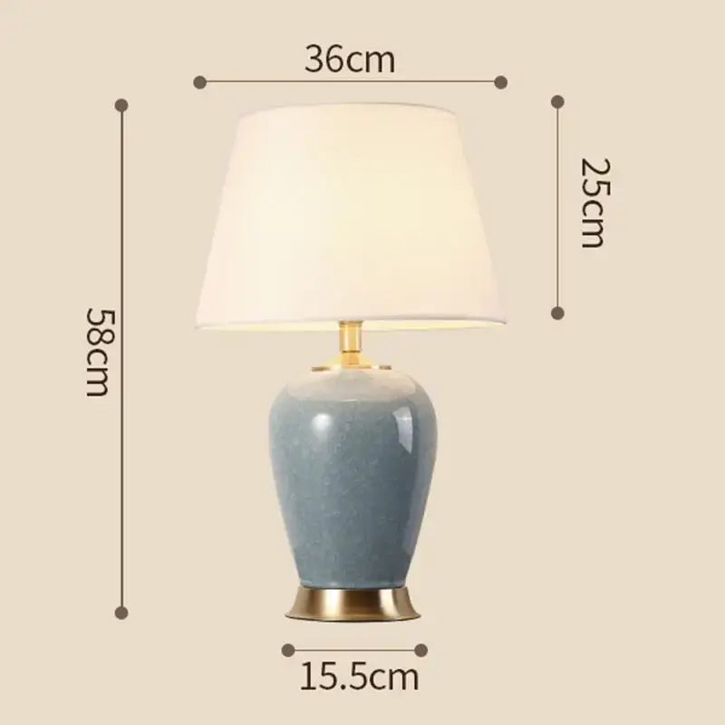 Light blue ice crack ceramic table lamp with gold base and white fabric shade for bedroom decor by decorbites ice crack
