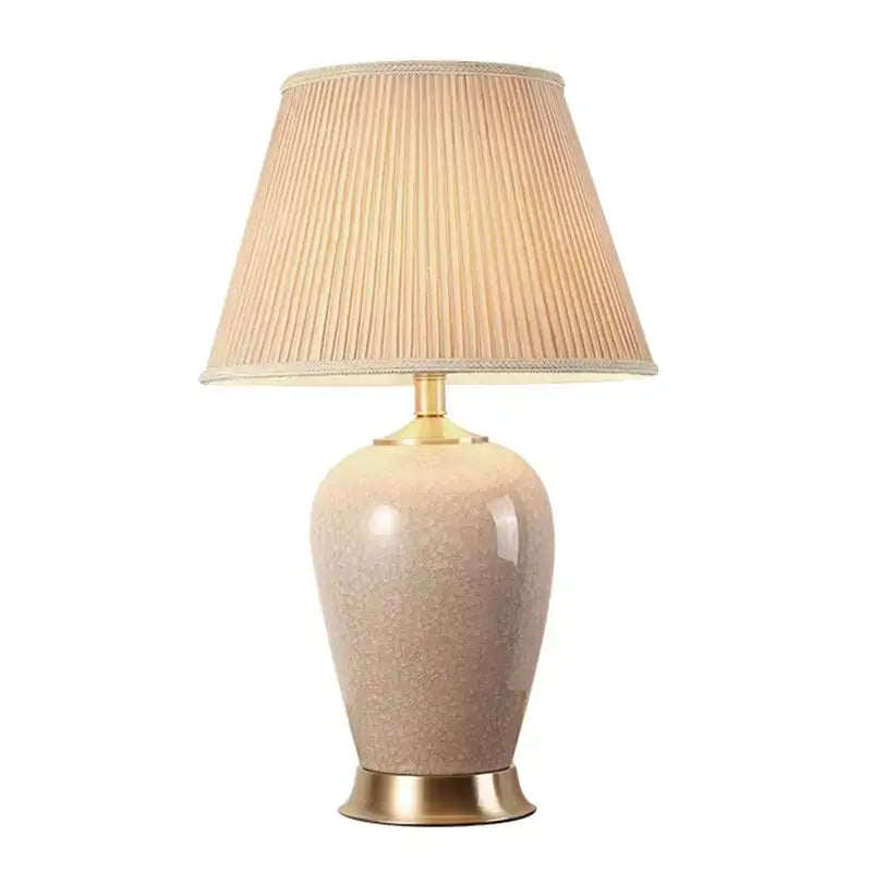 Beige ice crack ceramic table lamp with gold base and pleated fabric shade for bedroom decorbites ice crack design