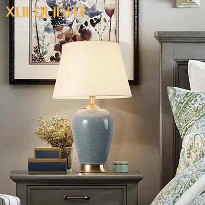 Light blue ice crack ceramic table lamp with gold base and soft white shade for bedroom decor by Decorbites ice crack