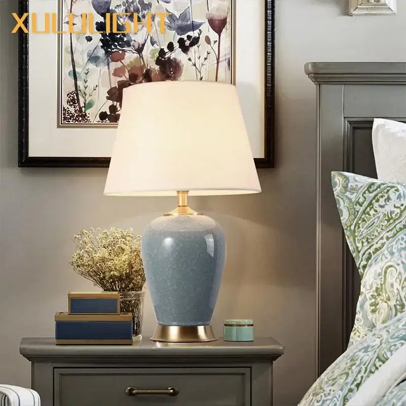 Light blue ice crack ceramic table lamp with gold base and soft white shade for bedroom decor by Decorbites ice crack