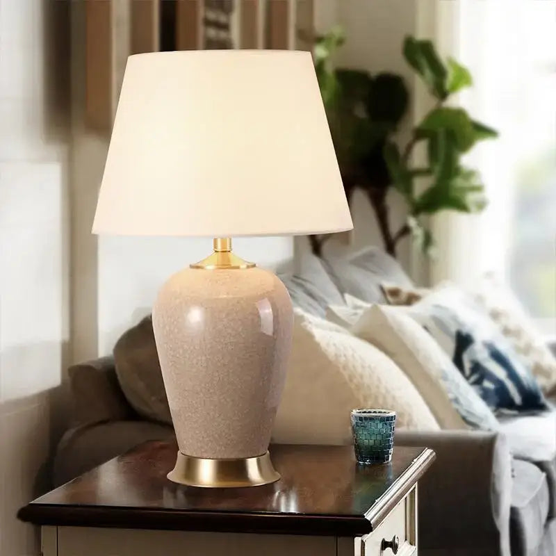 Beige ice crack ceramic table lamp with gold-toned metal base and cream fabric shade for bedroom decorbites ice crack