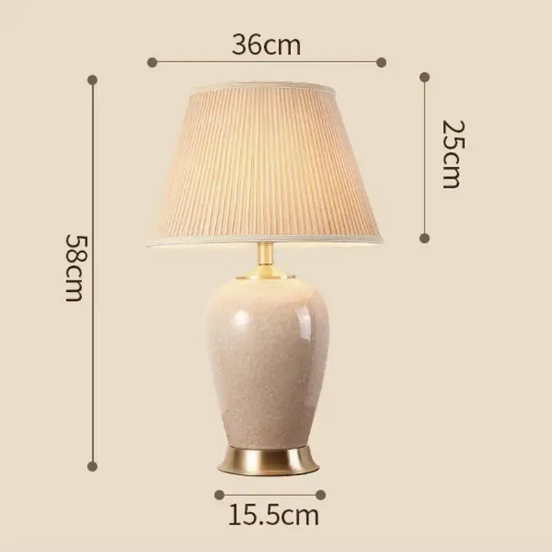 Beige ice crack ceramic table lamp with gold-toned metal base and pleated off-white shade for bedroom decorbites ice crack