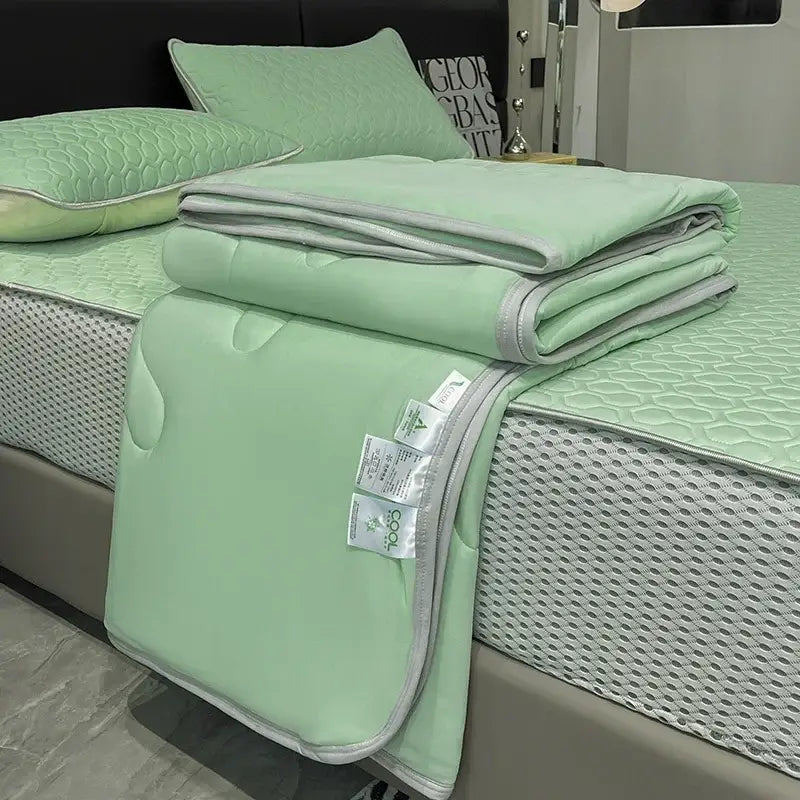Light blue ice silk quilt set with mint green quilted bedspread and gray piping for decorbites cool feeling bedding