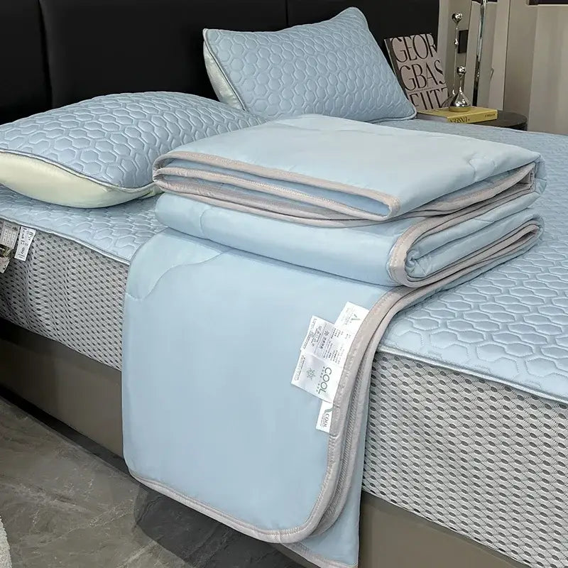 Light blue ice silk quilt set with gray piping and honeycomb texture offering decorbites cool feeling bedding