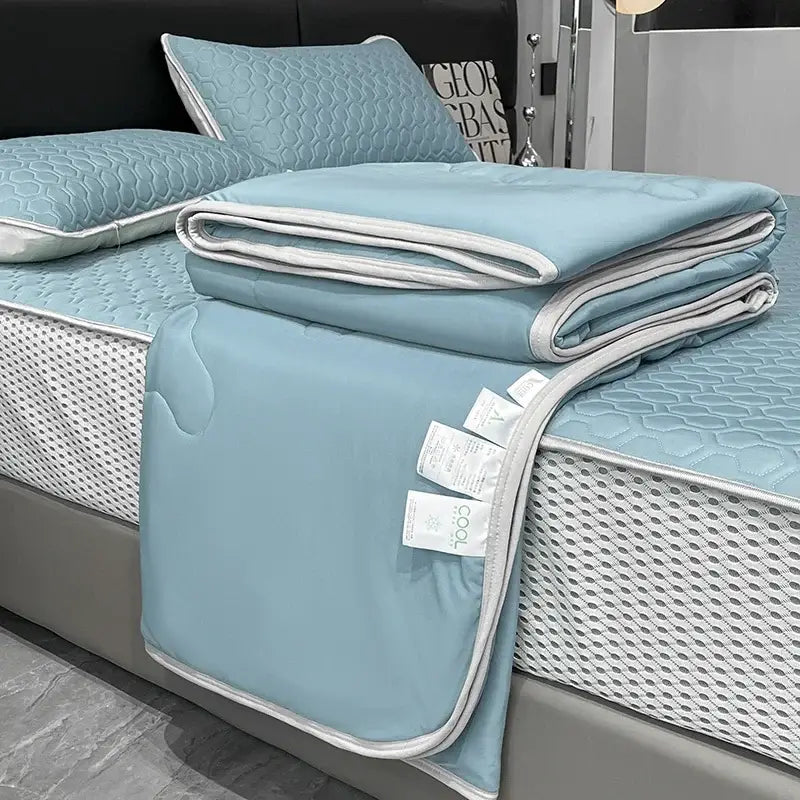 Light blue ice silk quilt set with white piping and textured honeycomb pattern for decorbites cool feeling bedding