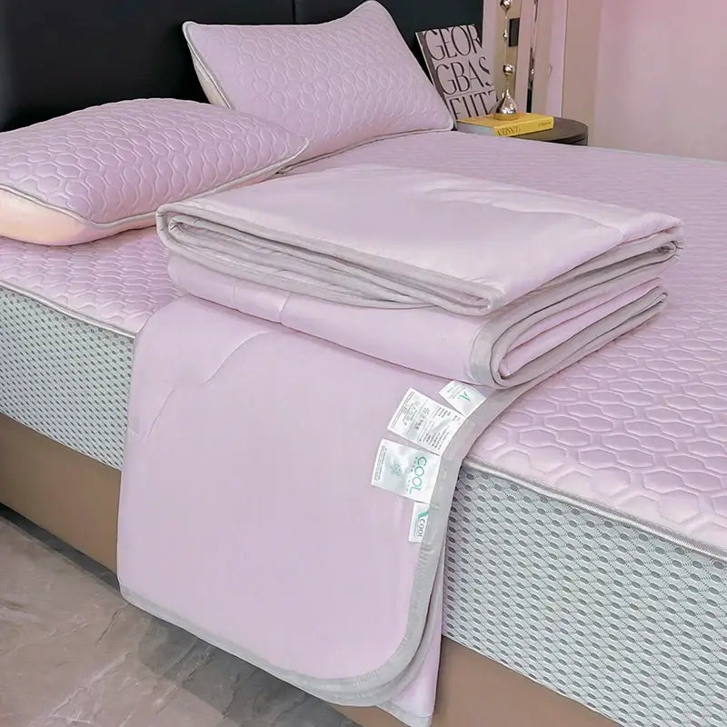 A soft lavender quilt set with hexagonal pattern and gray trim made of cool feeling ice silk for decorbites bedroom