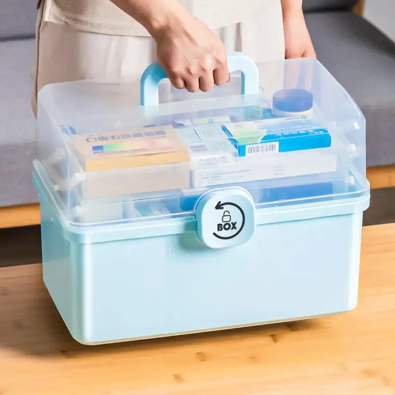 Light blue multifunctional emergency box plastic aid kit with transparent lid handle and circular lock emblem decorbites household