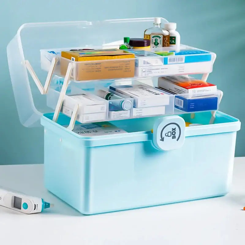 Light blue multifunctional emergency box with two-tier plastic organizer, clear lid, and white handle for aid kit use
