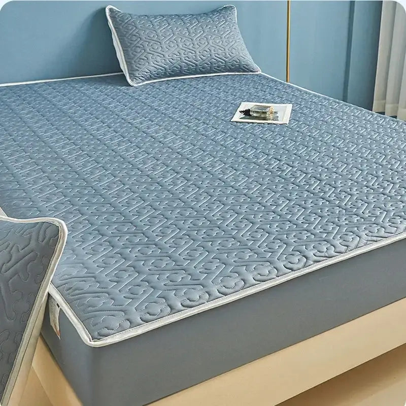 Light blue quilted latex fitted sheet set with subtle geometric pattern and white piping for bedroom bed pad