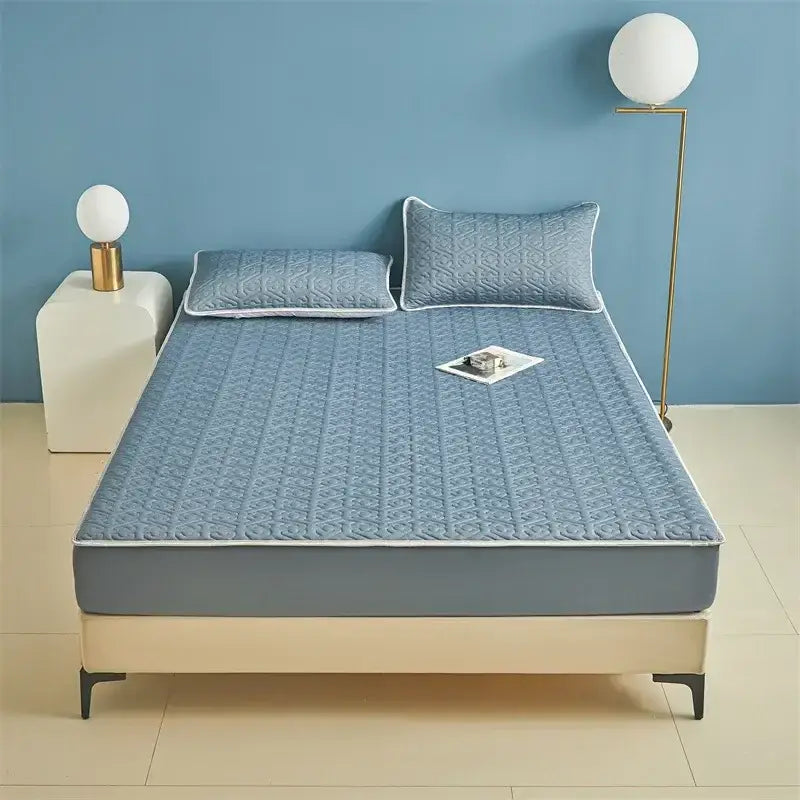 Light blue quilted latex fitted sheet set with white trim and matching pillows for bedroom bed pad use