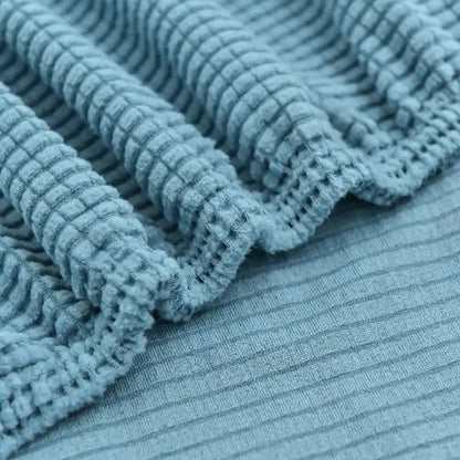 Light blue quilted thicken sofa cover featuring a light blue ribbed fabric with a textured waffle knit pattern decorbites 3d quilted