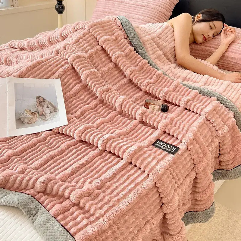 Pink corduroy throw blanket with gray ribbed trim featuring cozy faux rabbit plush texture for decorbites cozy faux decor