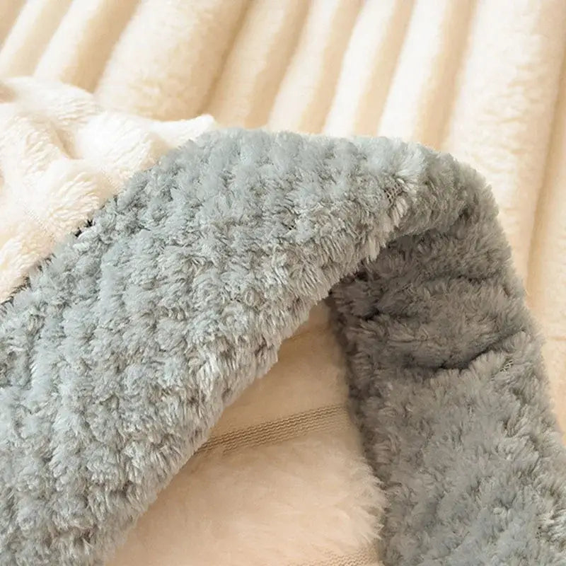 Soft gray plush blanket with fluffy textured surface and cream lining cozy faux rabbit decorbites bedroom shawl
