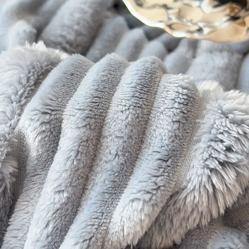 Light blue ribbed cozy faux rabbit plush blanket with soft gray ribbed fabric and fluffy inner lining for decorbites cozy faux use