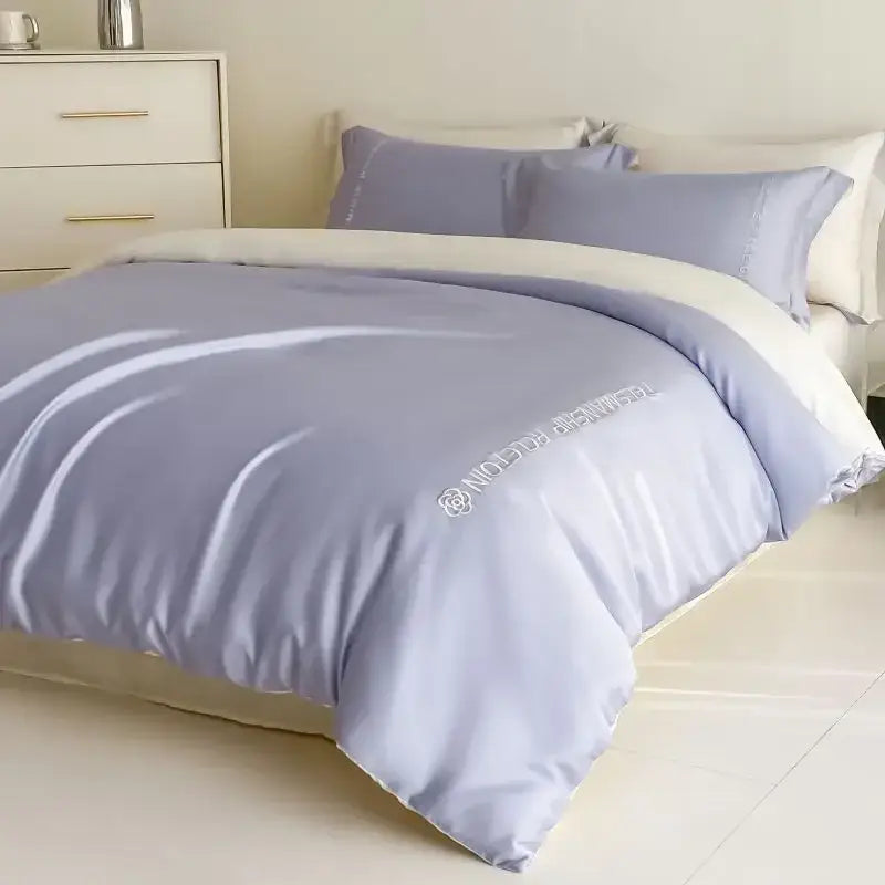Light purple satin cotton embroidery bedding set with white trim and subtle decorbites branding for bedroom decor