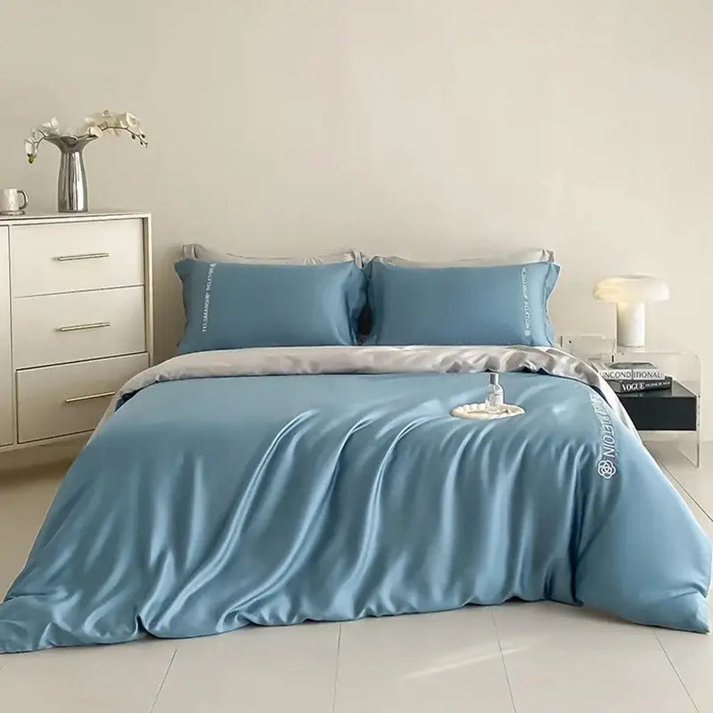 Light blue satin cotton embroidery bedding set with subtle silver trim by decorbites for elegant bedroom decor