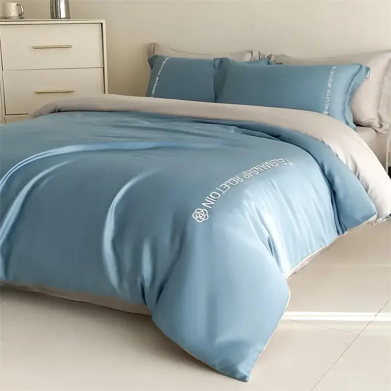 Light blue satin cotton embroidery bedding set with white embroidered text and logo for bedroom decorbites cotton embroidery