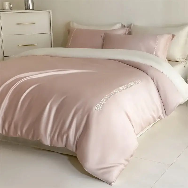 Light blue satin cotton embroidery bedding set featuring a soft blush pink satin duvet cover with subtle white embroidery