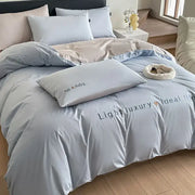 Light blue satin embroidery bedding set featuring a duvet cover with subtle embroidered text for bedroom decorbites